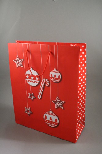 Christmas Gift Bag with White Bauble and Star Design. Red Corded Handles and Polka Dot Side Panel Size Approx 32cm x 26cm x 10cm.