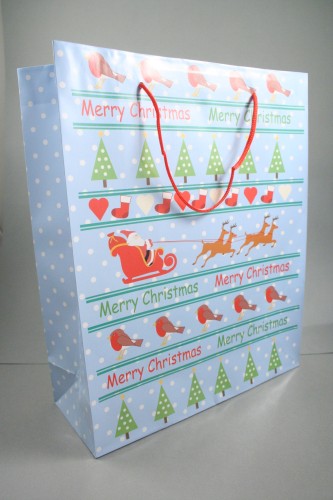 Merry Christmas Giftbag with Robins, Trees, Santa and Reindeer on a Blue Background with Red Cord Handles. Approx Size 32cm x 26cm x 10cm